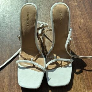 White women’s high heels, size 8